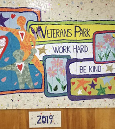 mosaic welcomes visitors and reminds students and staff to work hard and be kind